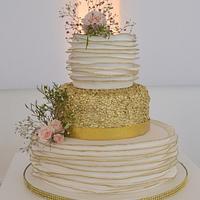 Gold edged ruffle and sequin wedding cake