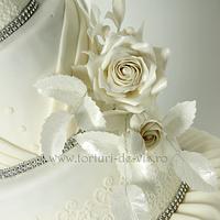 White wedding cake with white roses