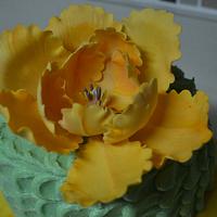 orange fantasy flower on green petal cake 