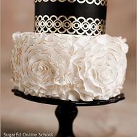 Gold leaf lace and fondant rosettes cake