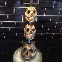 Three Impaled Skulls