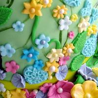 Cake with flower garden and butterflies