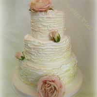 Ivory ruffled wedding cake