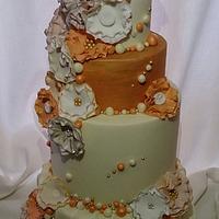 cream gold and peach tiered wedding cake 