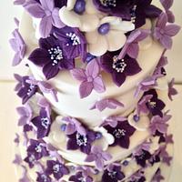Purple flowered wedding cake 