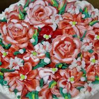 Red and white buttercream flower cake