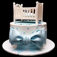 Baby cot baby shower cake