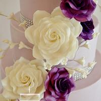 Purple wedding cake with roses