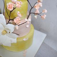 Gold and cherry blossom wedding cake