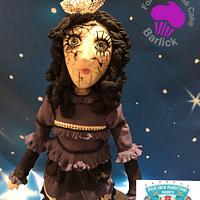Freaky Fiona the haunted broken doll from the haunted house room at cake carnival