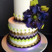 Purple, gold and Green Chevron cake with Purple fantasy flower.