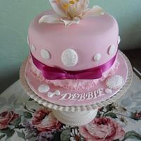 fantasy lily cake with vintage buttons and frills.