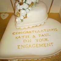 white and gold engagement cake 