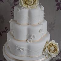 Vintage lace and blossoms wedding cake