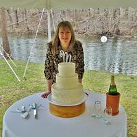 Buttercream wedding cake by river