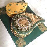 Paisley shaped antique gold & emerald henna ceremony cake