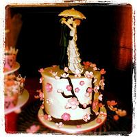 cherry blossom wedding theme cake and cupcakes