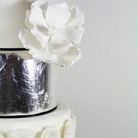 Silver leaf and magnolia wedding cake