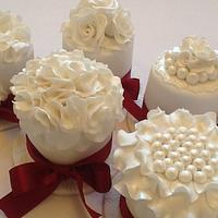 Two tie white dome rose wedding cake and gift cakes