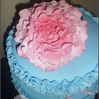 Blue ruffle cake with pink flower