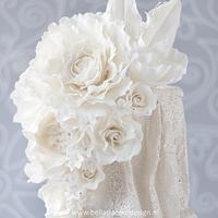 Classy white lace wedding cake