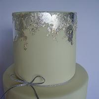 Grey, ruffle and silver leaf wedding cake.