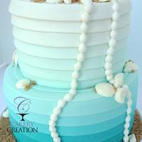Beachy Ombre Wedding cake with Pearls and shells