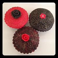 Black and red embossed cupcakes. 