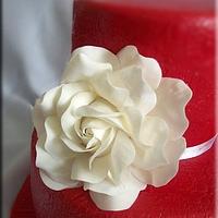 Red wedding cake with white rose