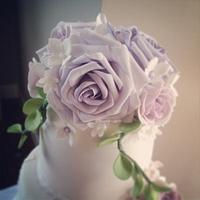 Lavender and lilac rose bloom wedding cake