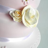 soft pink wedding cake with roses