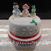 Christmas fruit cake with edible snow family 