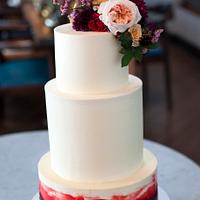 Buttercream cake with deep red watercolour