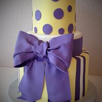 Purple and yellow baby shower cake