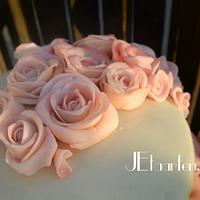 Wedding cake with lots of pink marzipan roses