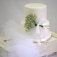 Delicate white wedding cake