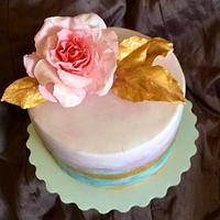 The birthday cake - gold and rose.
