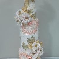 Wedding cake in peach , gold and peony