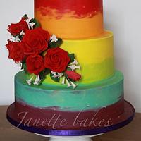 Rainbow cake with red roses