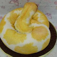 yellow python shaped cake 