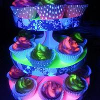 Black light glowing cupcakes and stand