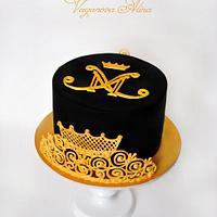 black and gold cake with logo