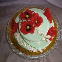 A cake with flowers of red weed