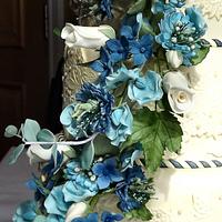 Ivory lace with blue hydrangea, sweet pea, and eucalyptus sugar flowers wedding cake :) x