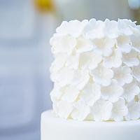 Wedding cake with lace and ruffles, a lots of ruffles.....