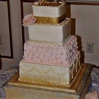 Square pink and gold buttercream wedding cake