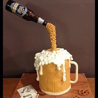 Pouring beer gravity defying cake. 