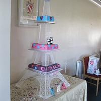 Eiffle Tower inspired Stand with brightly coloured cakes
