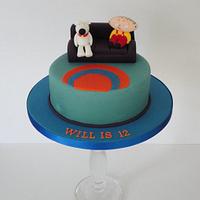 Family guy style cake, stewie and brian on the sofa