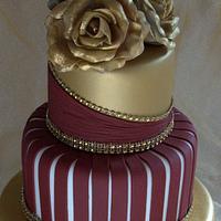 Gold and burgundy wedding cake